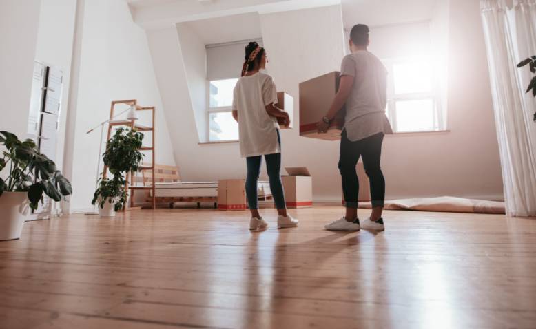 Young couple moving into home