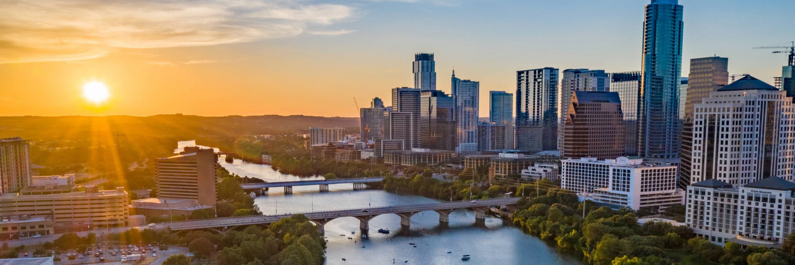 Lady Bird Lake and Austin skyline at sunset