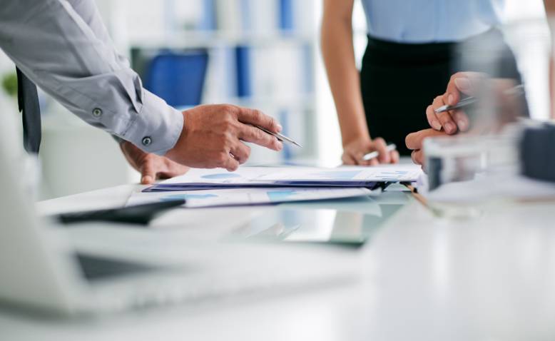 People reviewing documents