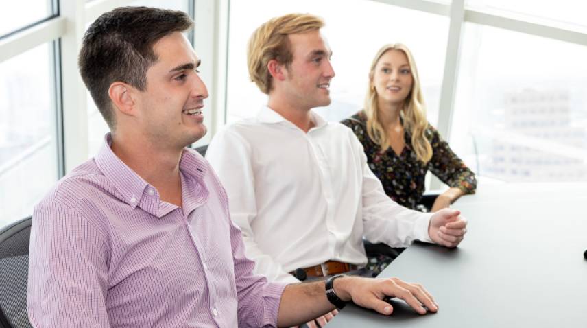 Analysts at conference room table