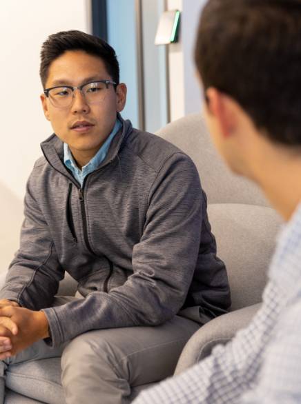 Young man talking with coworkera